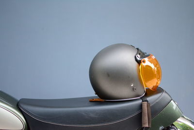 Close-up of coin-operated binoculars against sky