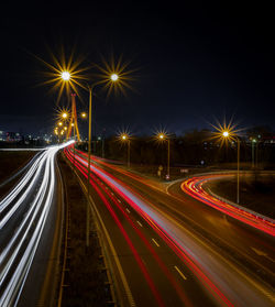 High angle view of light trails on road at night