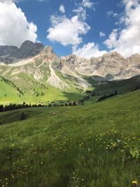 Scenic view of landscape and mountains against sky