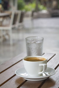 Coffee cup on table at cafe