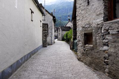 Alley amidst houses in town