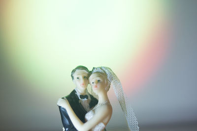 Portrait of couple kissing against clear sky