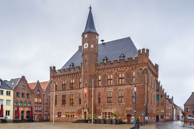 Buildings in city against sky