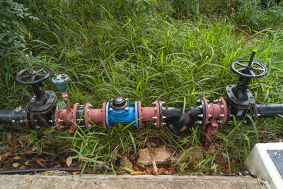 High angle view of old machinery on field