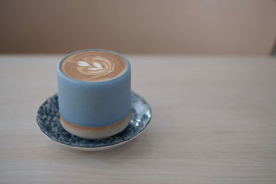 Close-up of coffee cup on table