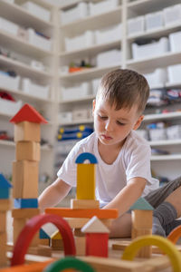 Boy playing with toy blocks