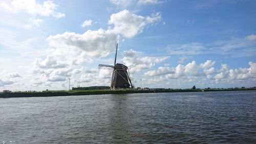 Traditional windmill against sky