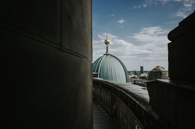 View of buildings against cloudy sky