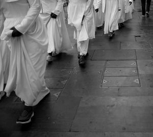 Low section of people walking on footpath