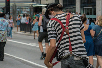 Woman looking at city street