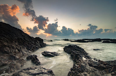 Rocky coastal feature against the sky