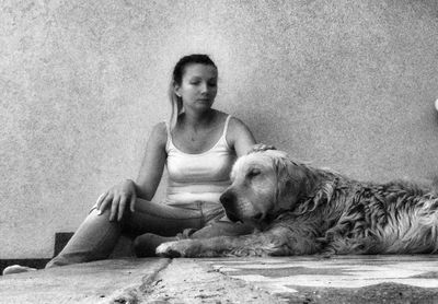 Portrait of a dog sitting on floor