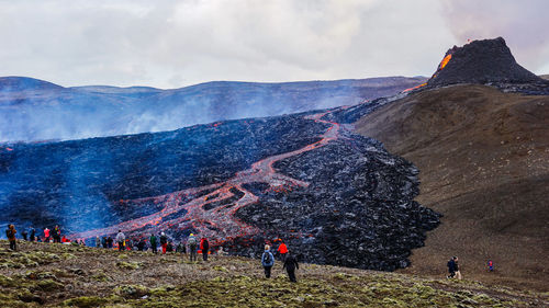 High angle view of people looking at volcanic landscape
