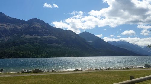 Scenic view of lake and mountains against sky