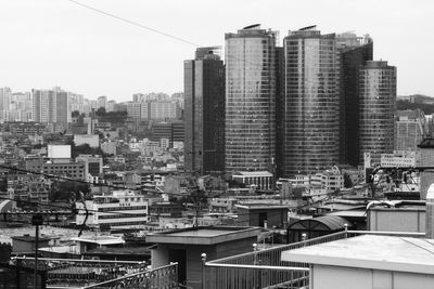 Modern buildings in city against sky