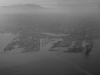 High angle view of city by sea