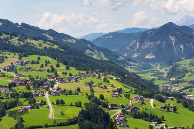 High angle view of townscape and mountains against sky