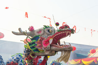 Amusement park ride against clear sky