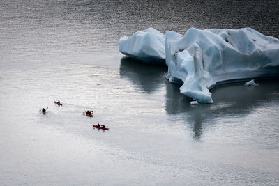 High angle view of people on sea