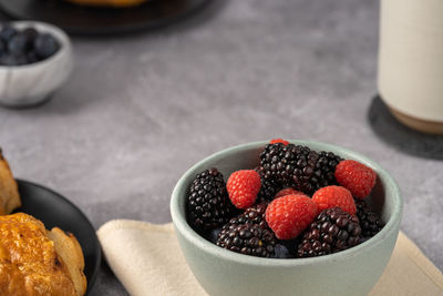 High angle view of strawberries in bowl on table