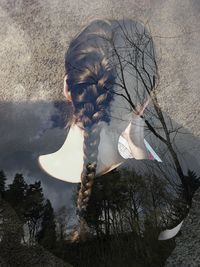 Digital composite image of woman with braided hair and forest