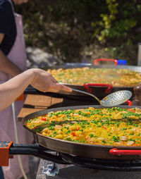 Close-up of man preparing food