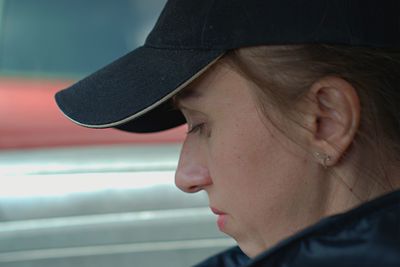 Close-up portrait of young woman looking away