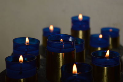 Zoom on blue candels in a small chuch