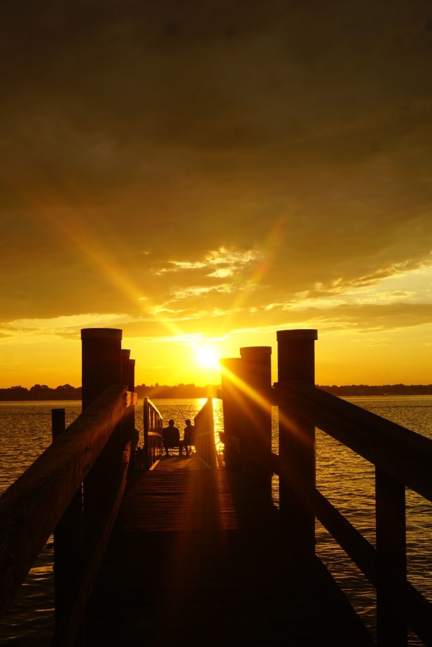 sunset, sky, water, cloud - sky, scenics - nature, beauty in nature, railing, sea, pier, tranquility, nature, orange color, wood - material, tranquil scene, architecture, idyllic, the way forward, built structure, sunlight, outdoors, horizon over water, sun