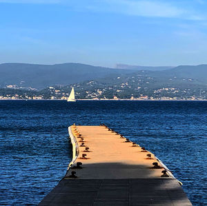 Sailboat on sea against sky