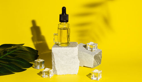 Close-up of glass bottles on table