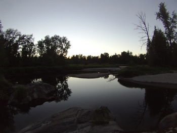 Scenic view of lake against sky during sunset