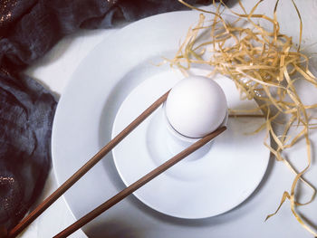 High angle view of eggs in plate on table