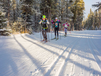 People in snow covered forest