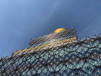 Low angle view of building against blue sky