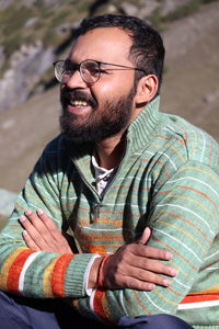 Low angle view of young man standing outdoors