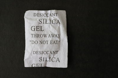 Close-up of text on paper against black background