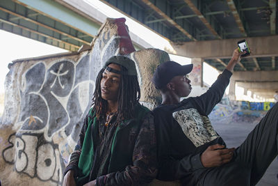 Two young men at a skateboard park.