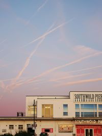 Low angle view of building against sky during sunset