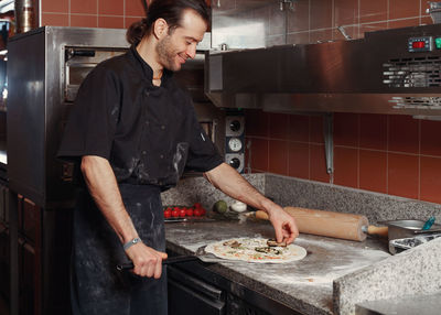 Chef preparing italian pizza