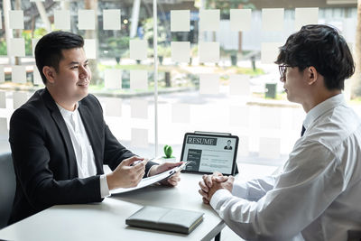 Businesswoman using laptop at office