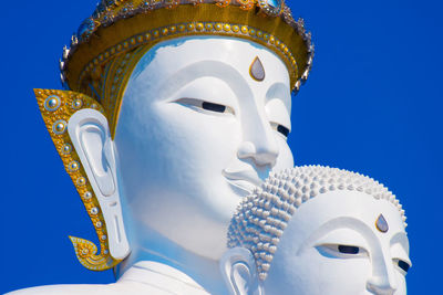 White buddha statue, blue sky at wat pha sorn kaew or phra that pha kaew, famous temple 