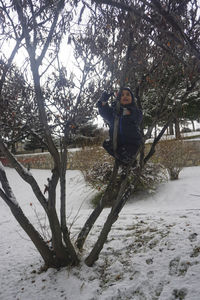 Young woman on snow covered land