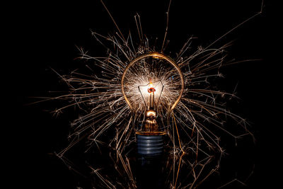 Firework display over black background