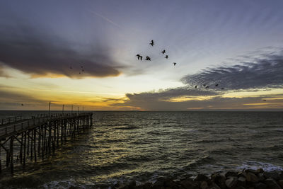 Scenic view of sea against sky during sunset