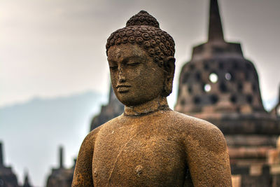 Close-up of buddha statue at borobudur temple