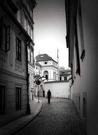 Woman walking in alley