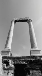 Low angle view of old structure against sky