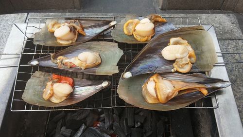 High angle view of seafood cooking on barbeque grill