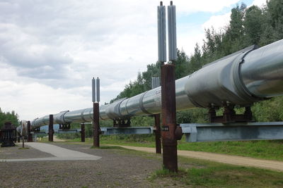 Built structure on field against sky